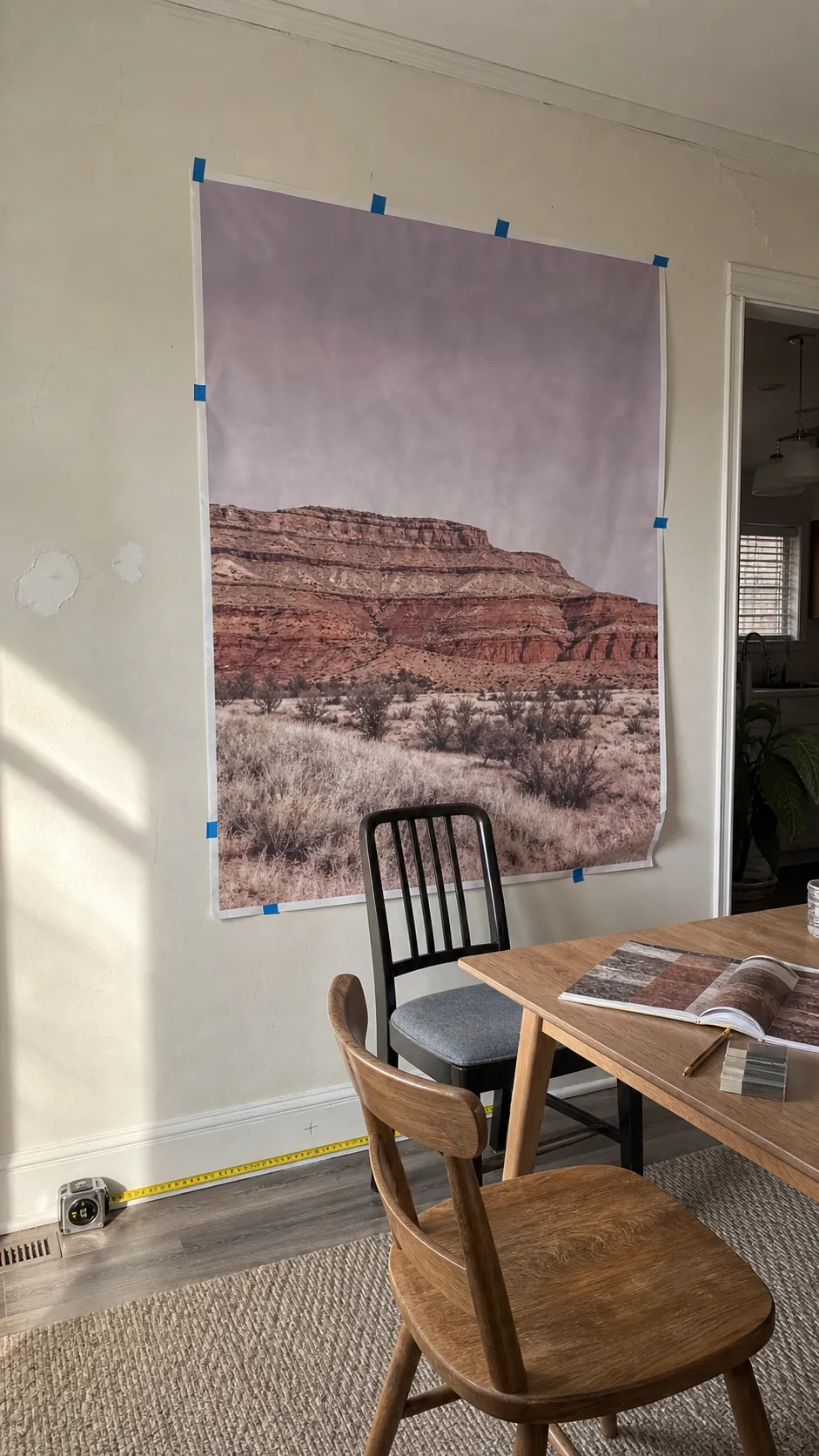 Large landscape mural sample tested beside a dining table in natural light