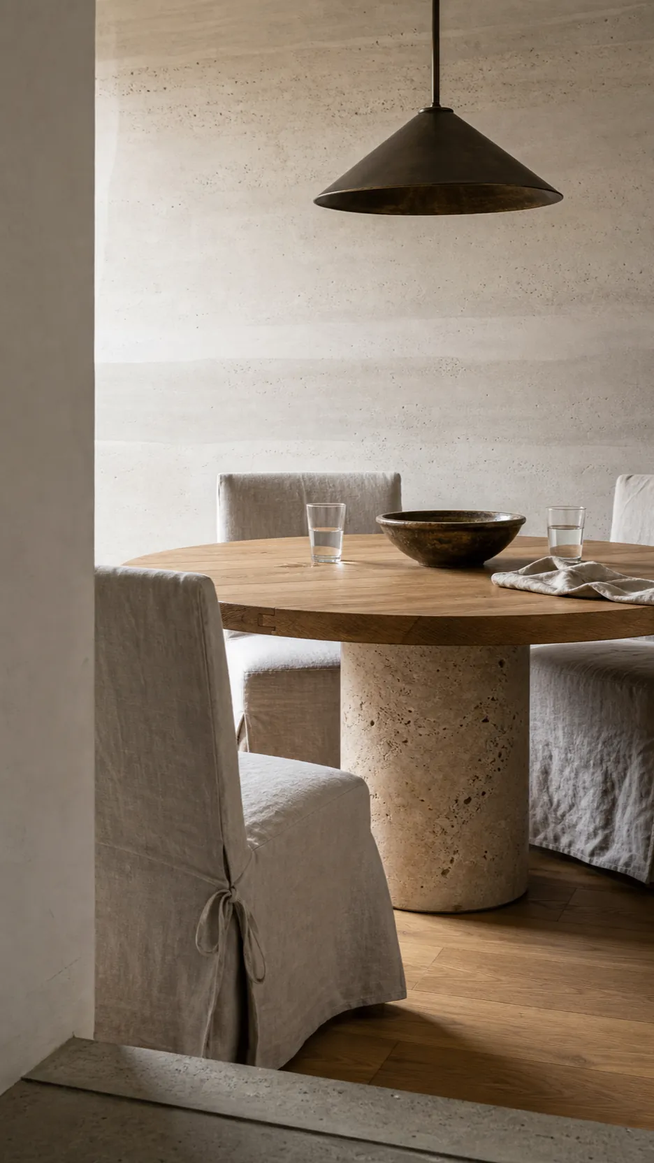 Faux plaster wall mural paired with oak linen and honed stone