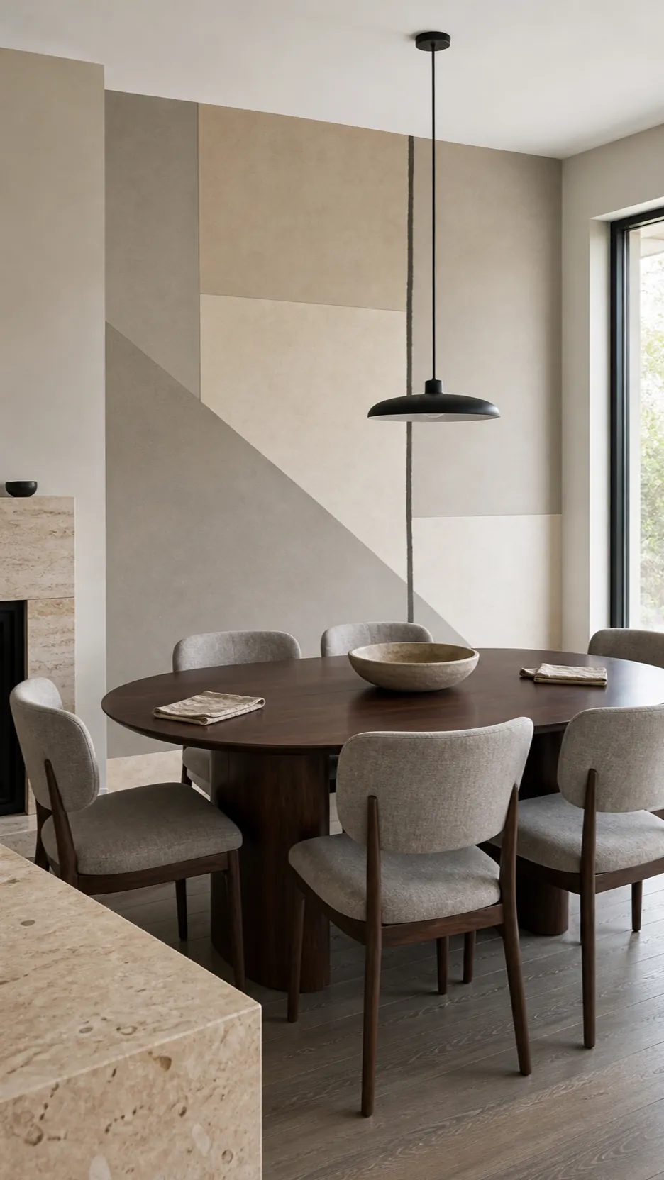 Greige abstract mural with black and dark wood counterpoints in a dining room