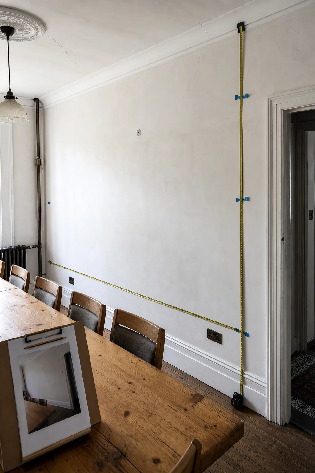 Long dining wall measured for a custom panoramic wallpaper mural