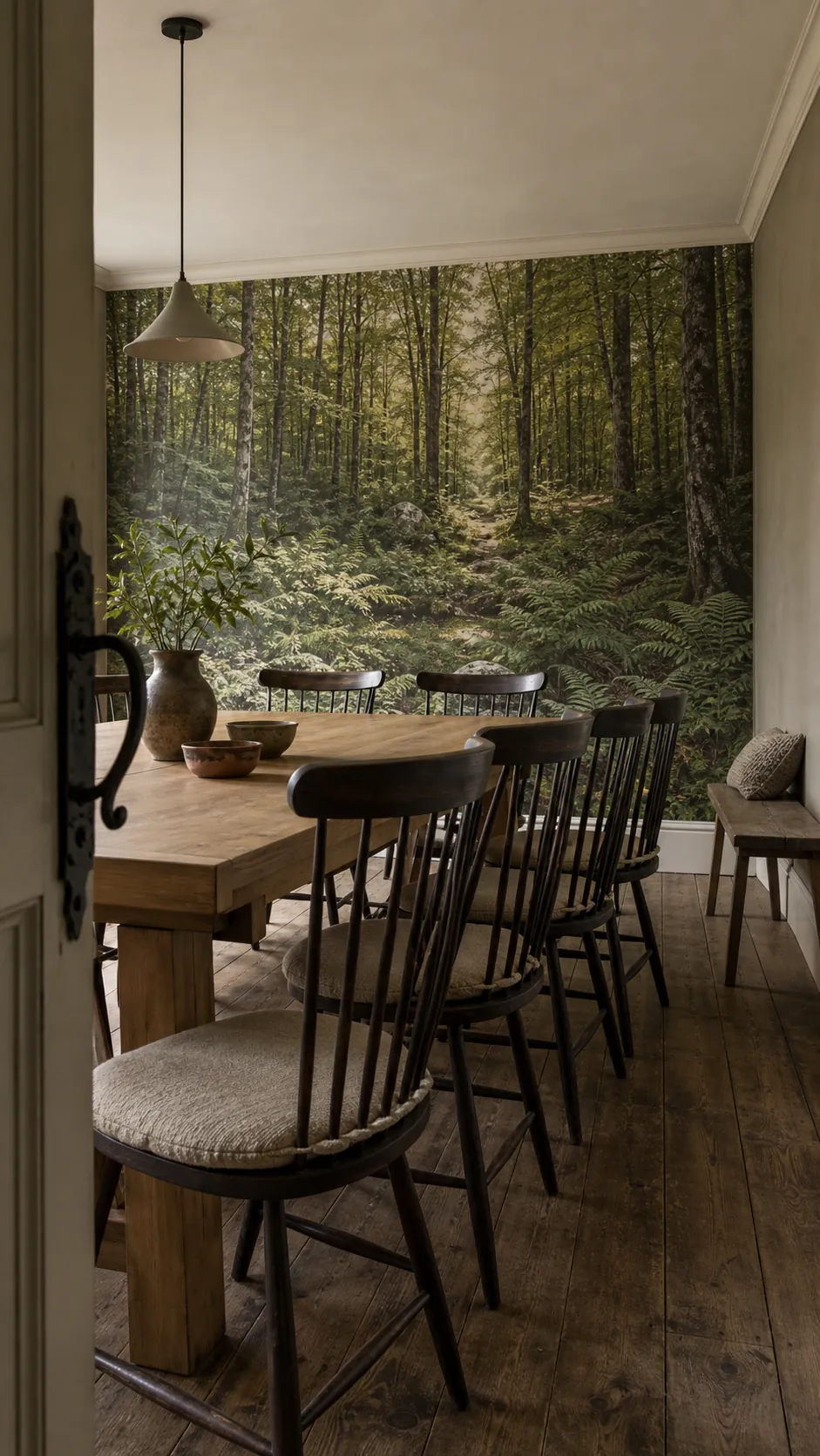 Open-back dining chairs preserving detail in a scenic forest mural
