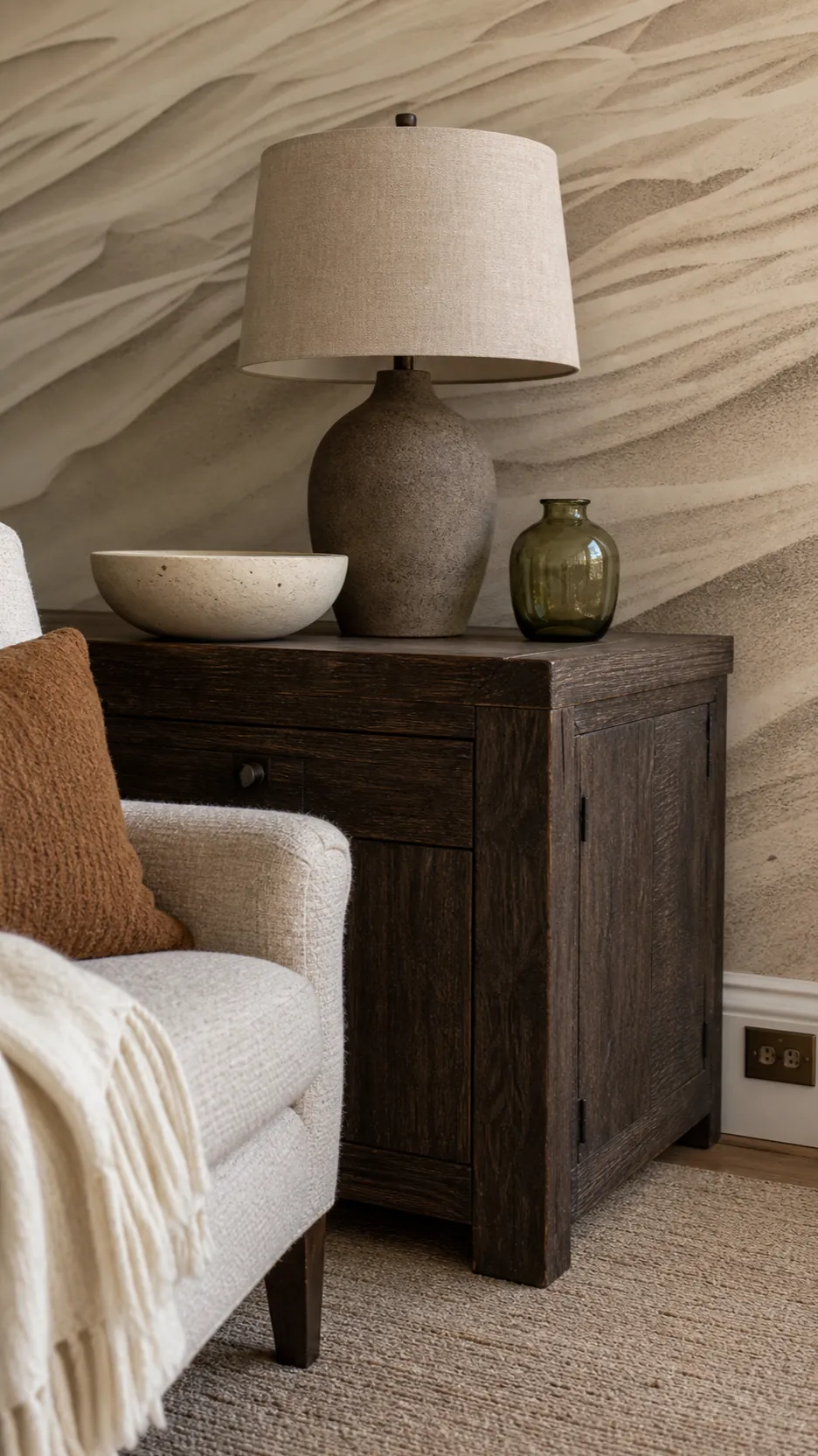 Sand and driftwood palette paired with a subtle coastal wallpaper mural