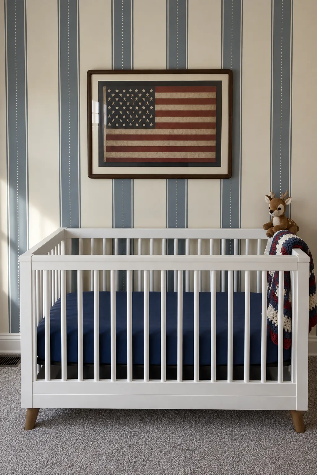 Nursery scheme with dusty blue stripes, a white crib, and vintage decorative accents.